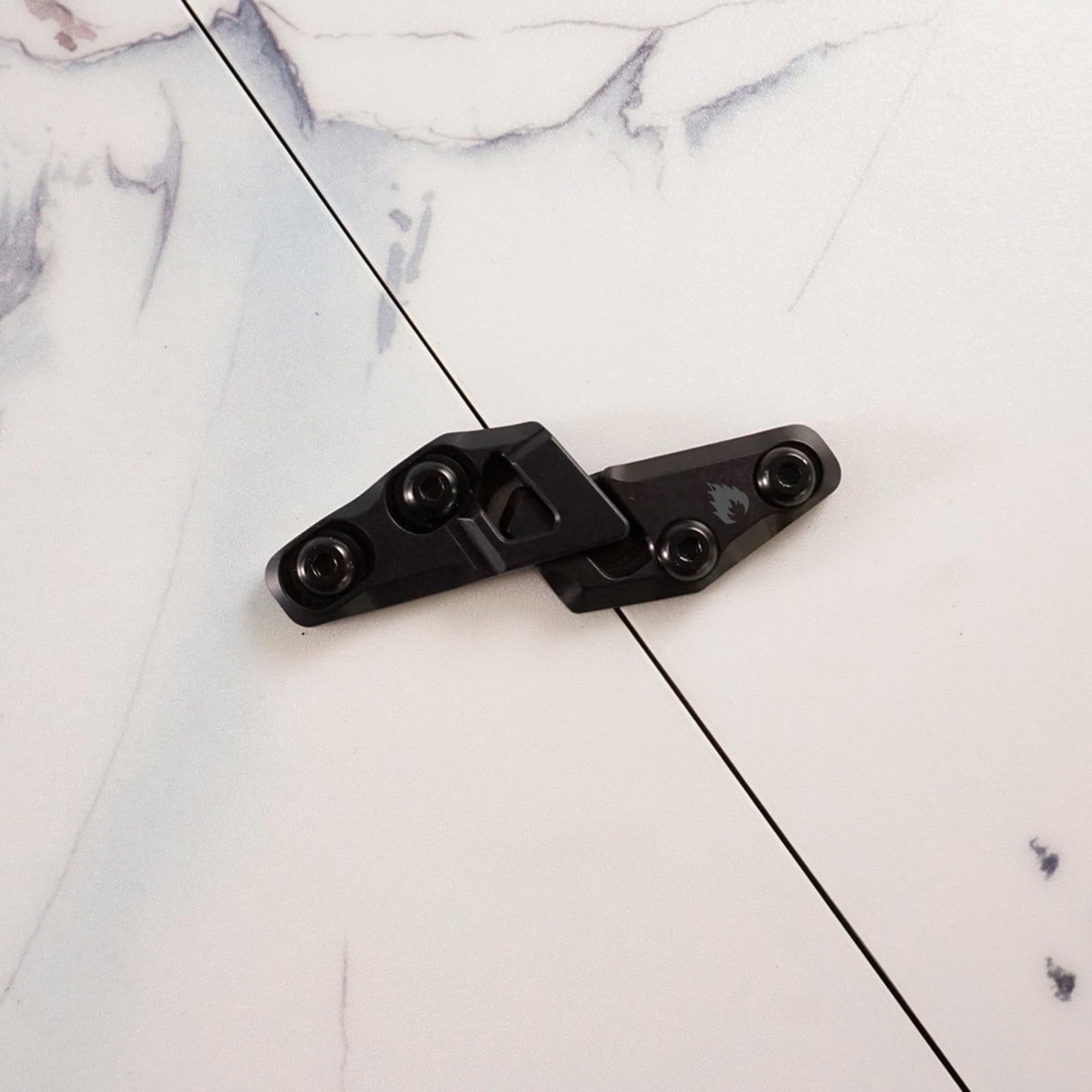 Closeup of aluminum Fixie top-mount clip highlighting durable, single-piece construction.