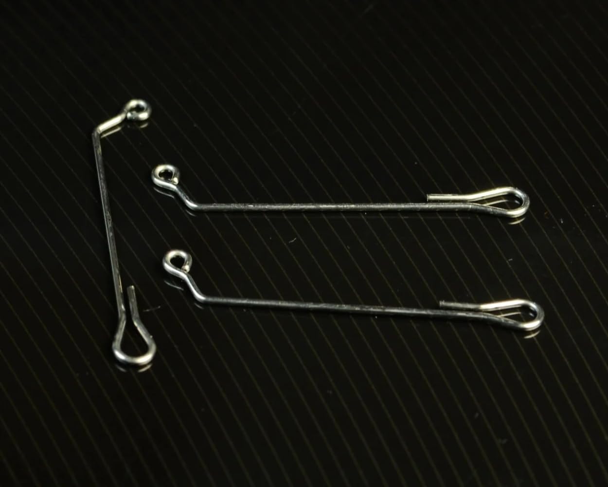 Spawn Fly Fish 60-degree jig shank in 40mm for lifelike side-to-side action.