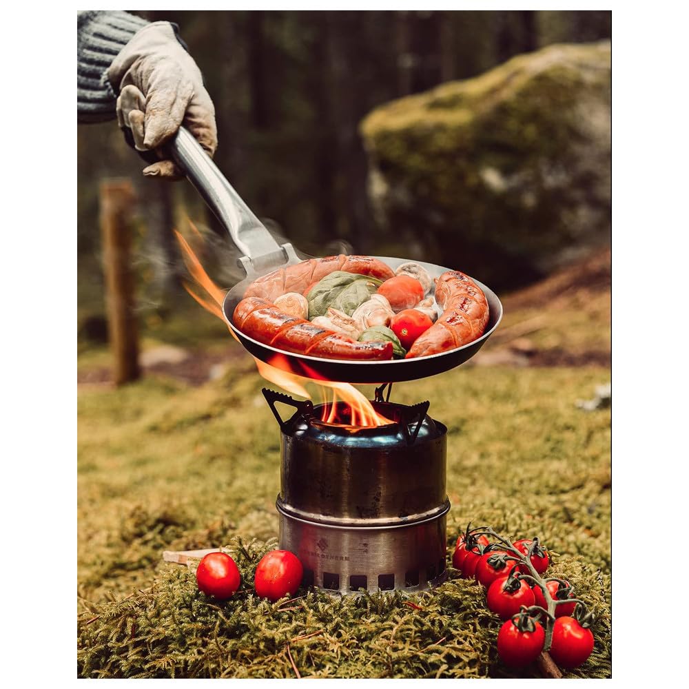 Stabilotherm Hunter Pan over open fire enables versatile outdoor frying.