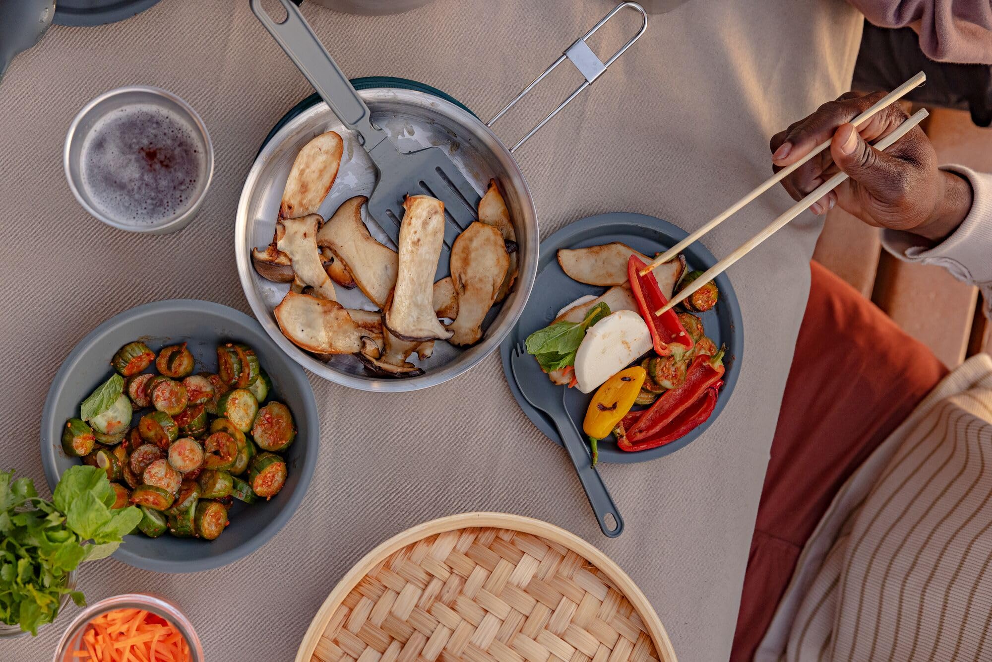 Stanley trivet protects cookware and campsite surfaces.