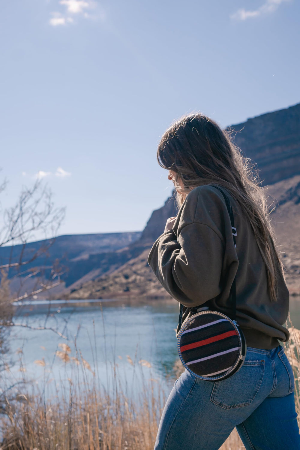 Stansport canteen with adjustable shoulder strap for hands-free hiking