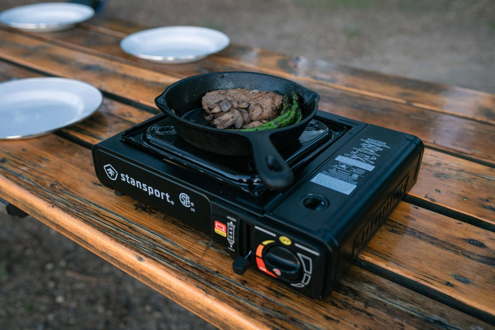 Stansport portable stove with canister compatibility for flexible fuel options.