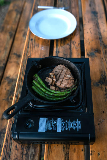 Stansport portable stove in hard carrying case for secure transport.