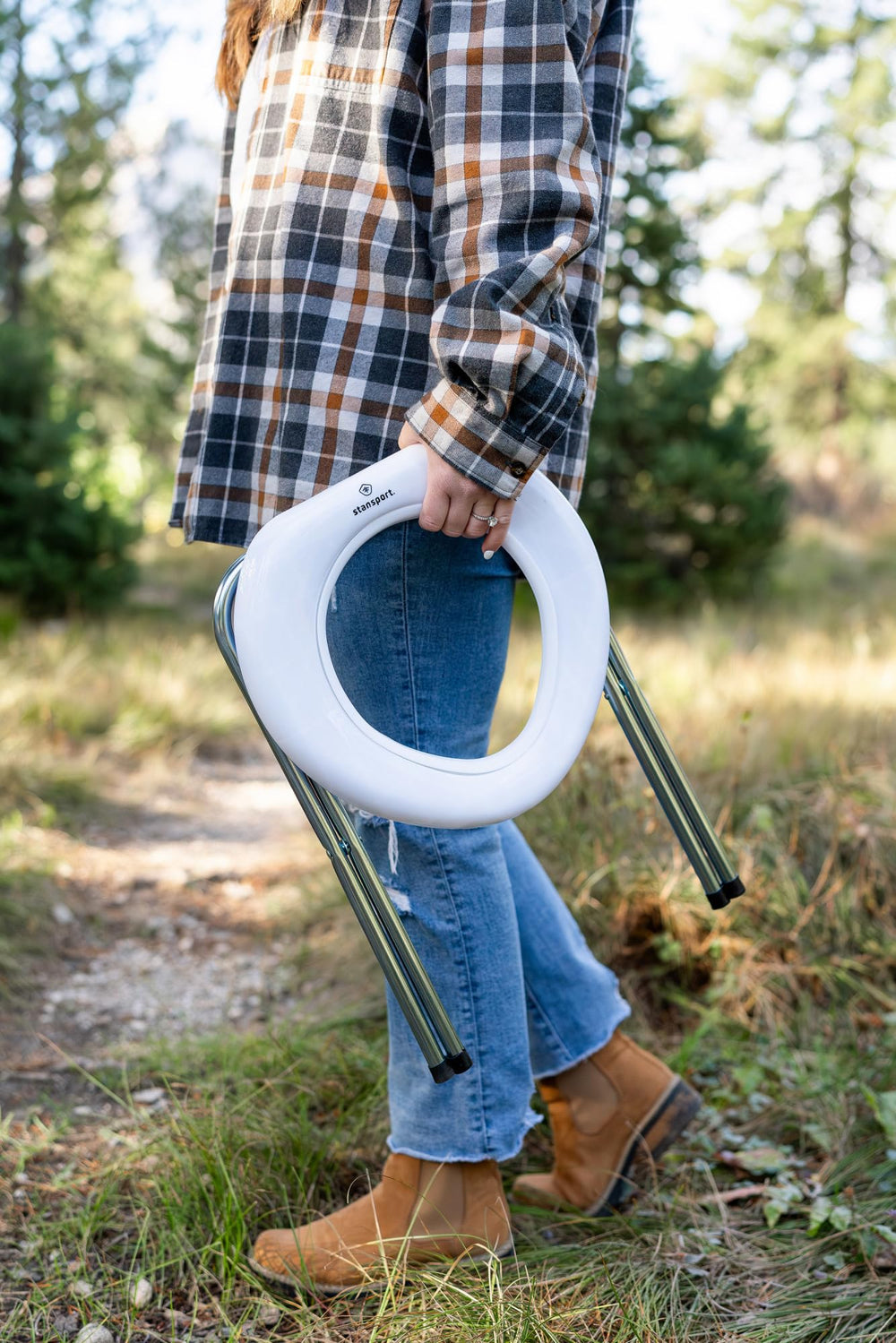 Stansport portable toilet's heavy-duty legs providing stability during camping