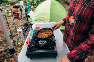 Stansport stove in outdoor catering setup for events.