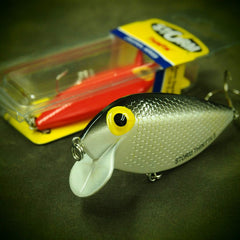 Storm ThinFin 06 back view shows red-silver finish and premium VMC hooks.
