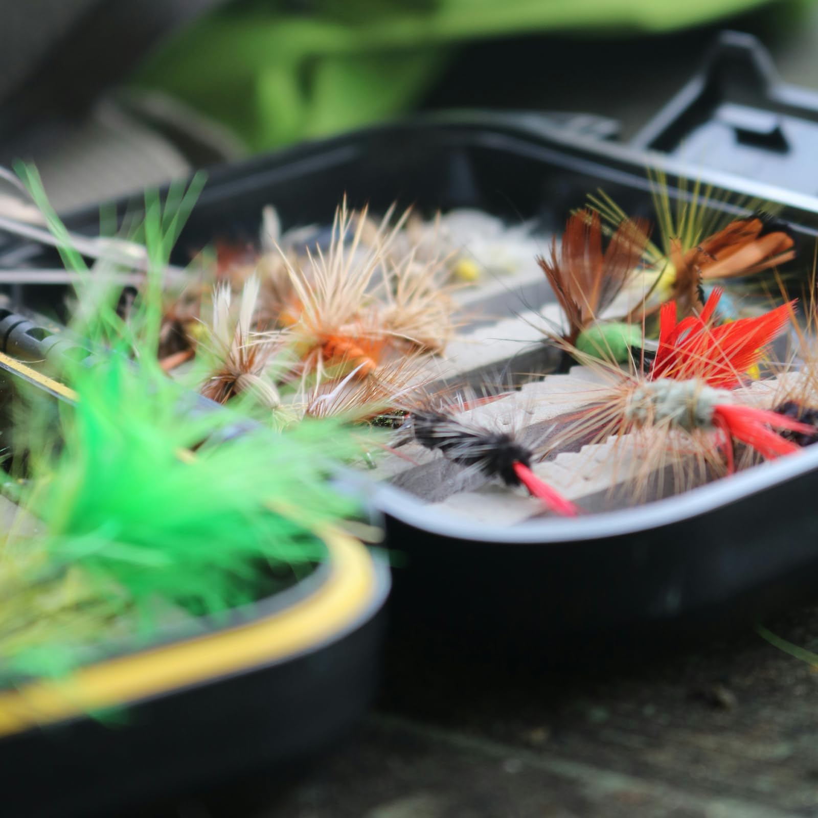 Assorted streamers, nymphs, and poppers for trout and bass