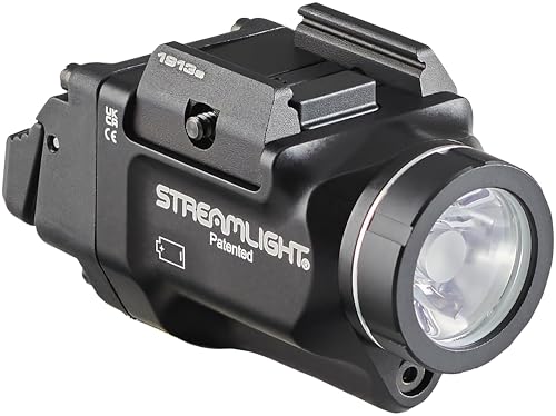 Integrated green aiming laser alongside the flashlight