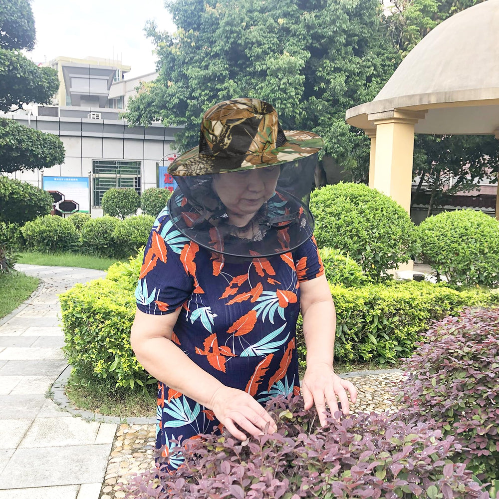 Outdoor garden setting with leaf camouflage hat