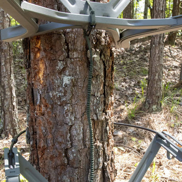 Summit Treestands umbilical tether keeping seat and foot platform connected during ascent.