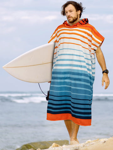 Sun Cube Surf Poncho hood protecting from sun and wind at the beach