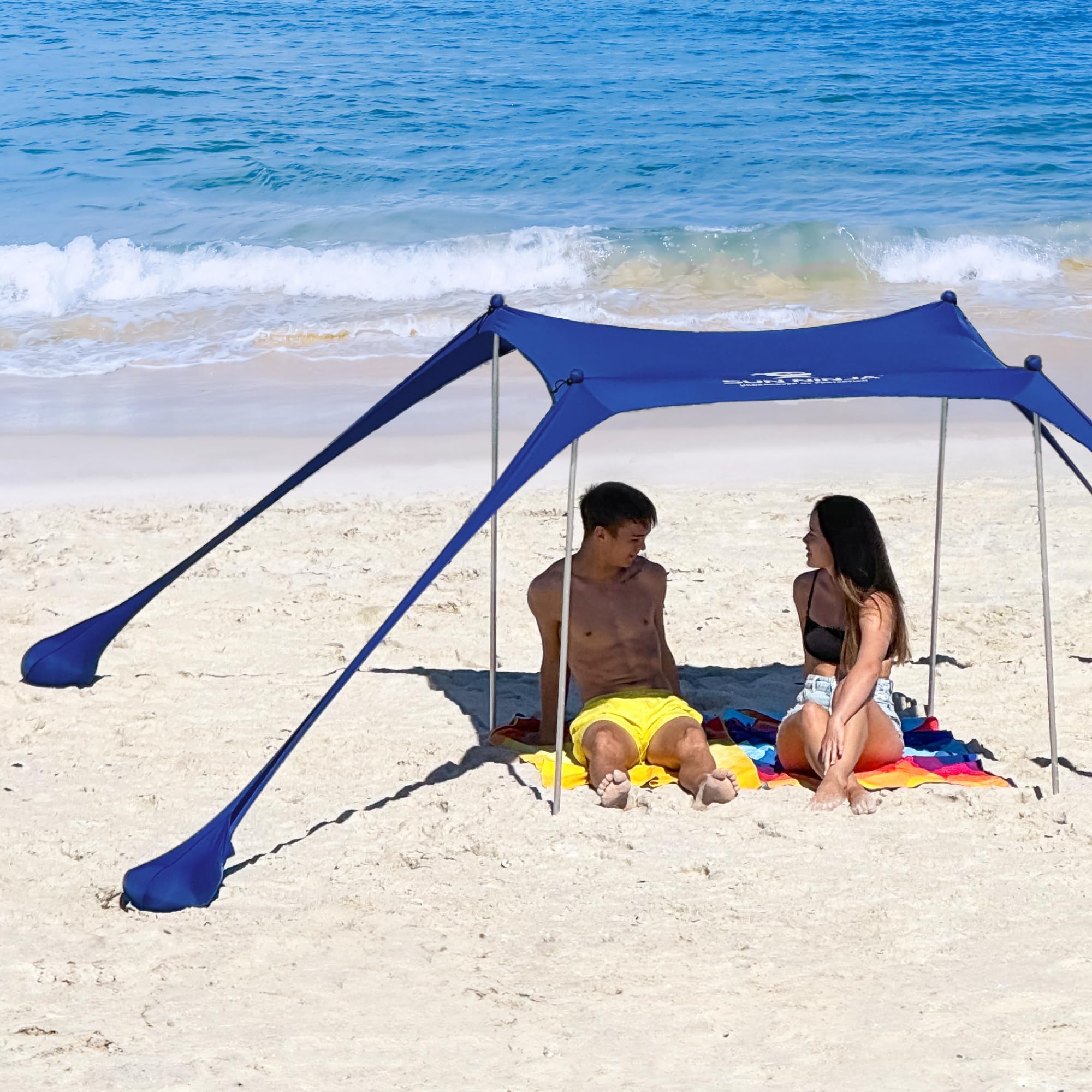 SUN NINJA navy fabric close-up showing UPF50+ protection and durable build.