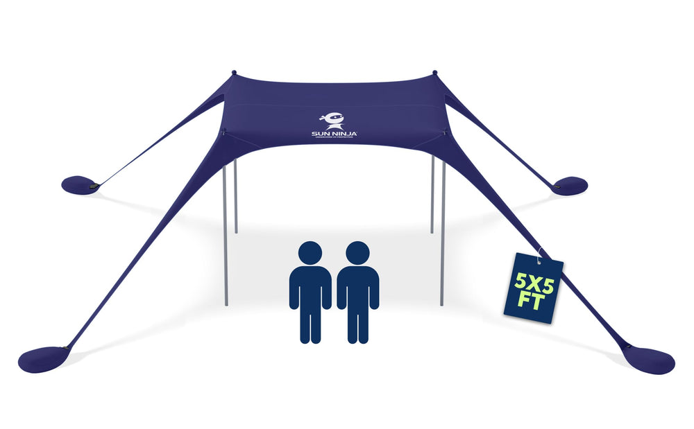 SUN NINJA Beach Tent Shelter shading a sunny beach for family comfort.