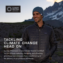 Reversible beanie showing exterior heather and solid interior