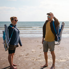 SunnyFeel Extra Wide 28-inch Low Beach Chair packed as backpack-ready chair for easy travel.
