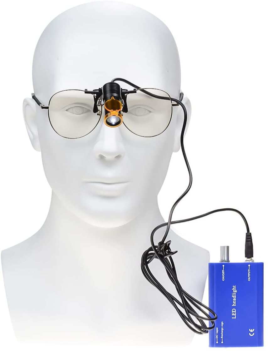 Superdental protable LED head light with binocular loupe clip for precise illumination.