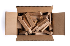 Superior Trading Co. oak mini firewood sticks pile shows ready-to-use kindling for cozy moments.