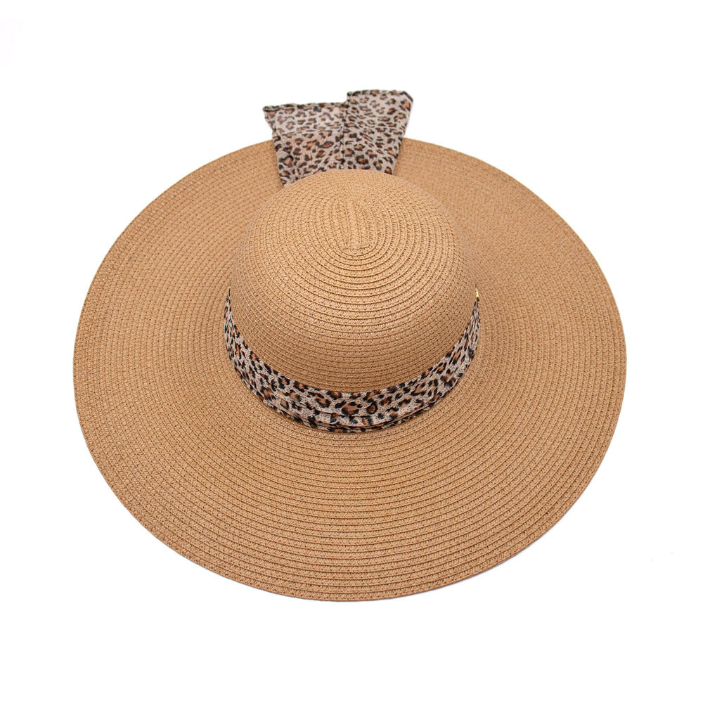 Surell wide-brim hat pairs with swimsuits, dresses, and casual looks.