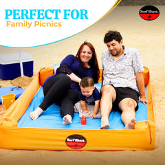 Surf Sheet anchored beach blanket with sandbags for stable, secure setup.