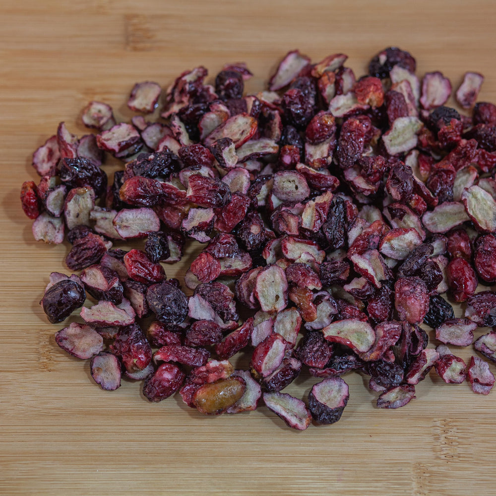 Survival Grocery Freeze-Dried Grape Halves held by hand for on-the-go snacking