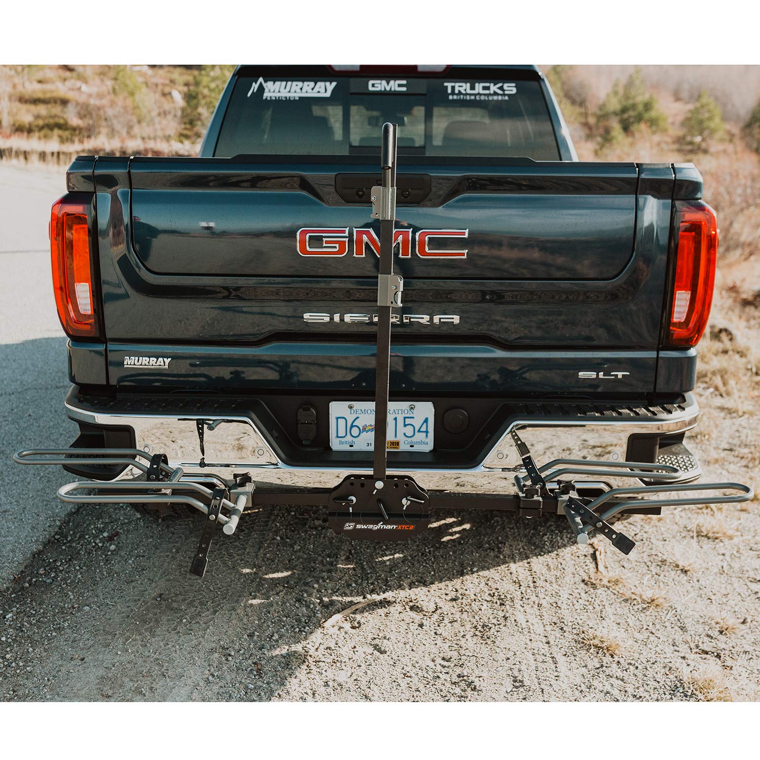 Center arm folds down for rear access with Swagman XTC2 mounted on car.