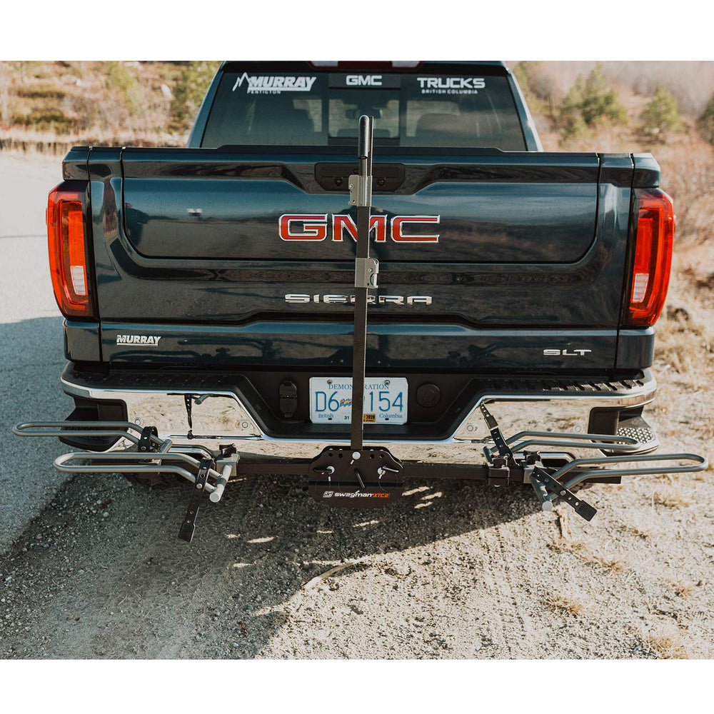 Center arm folds down for rear access with Swagman XTC2 mounted on car.