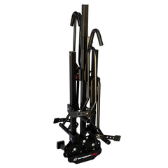 Loading bikes onto Swagman XTC2 wheel trays for secure mounting.