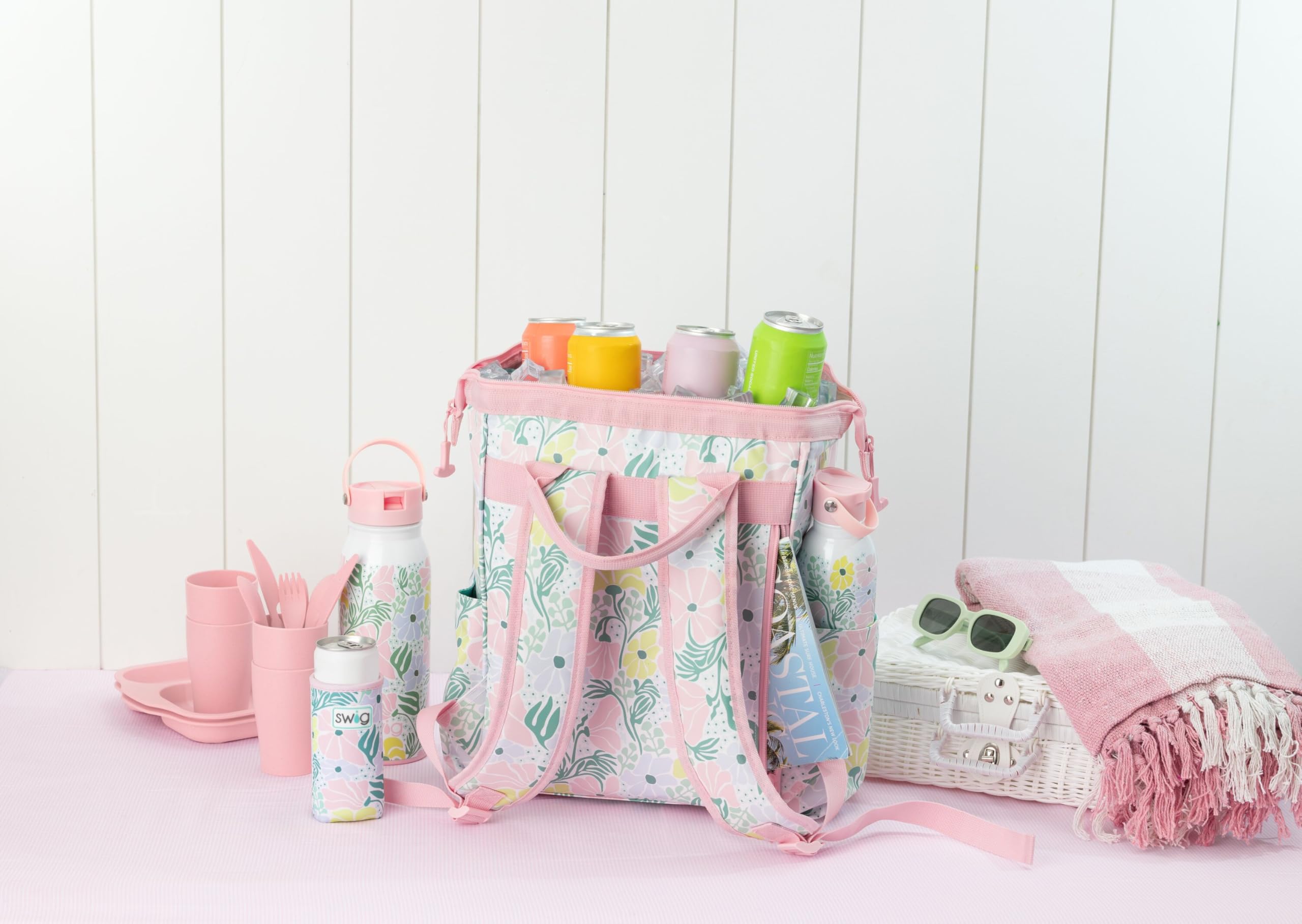 Swig Life Packi Backpack Cooler side view highlights side pockets for bottles and accessories.