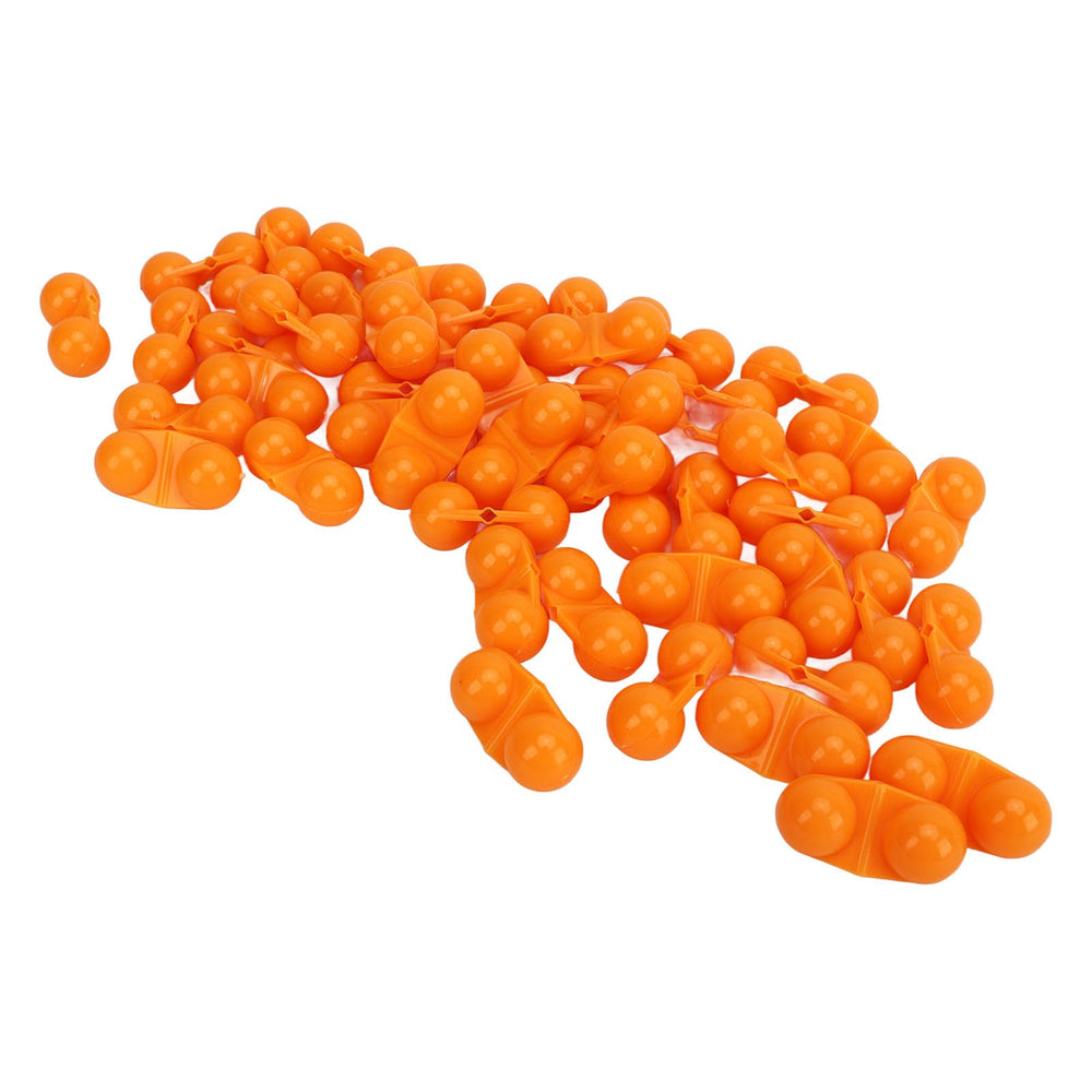 Close-up of metal beads and clear plastic storage case for catfish rattles
