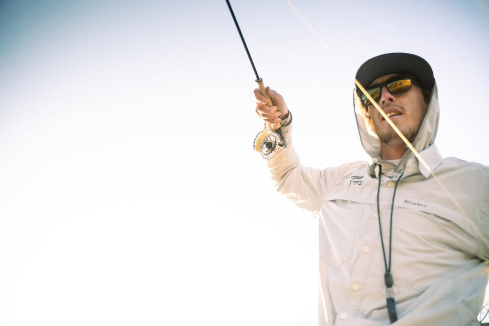 Temple Fork Outfitters Blue Ribbon rod 4wt-10ft-4pc in hand for precise dry fly casting.