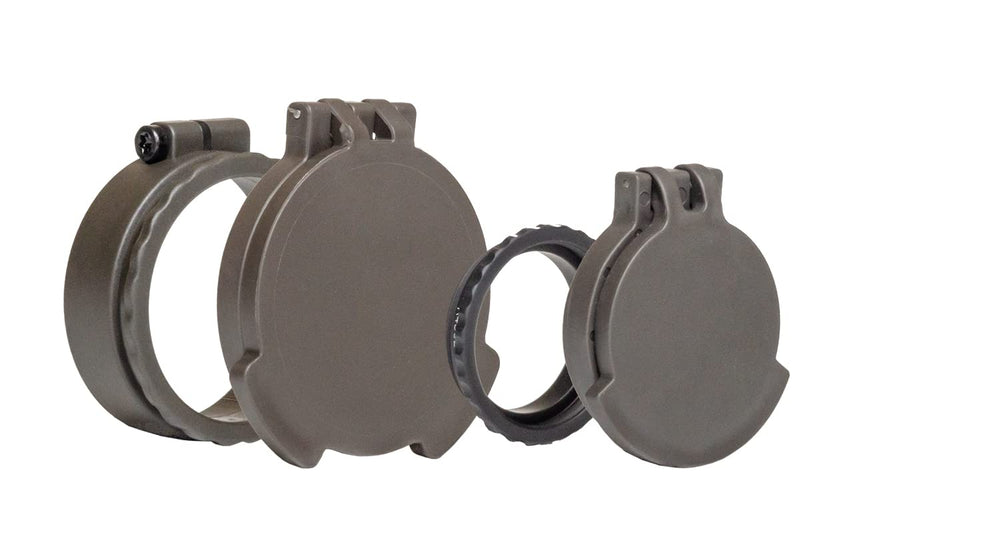 Tenebraex front flip cover assembly guarding ocular lenses against debris in rugged field conditions