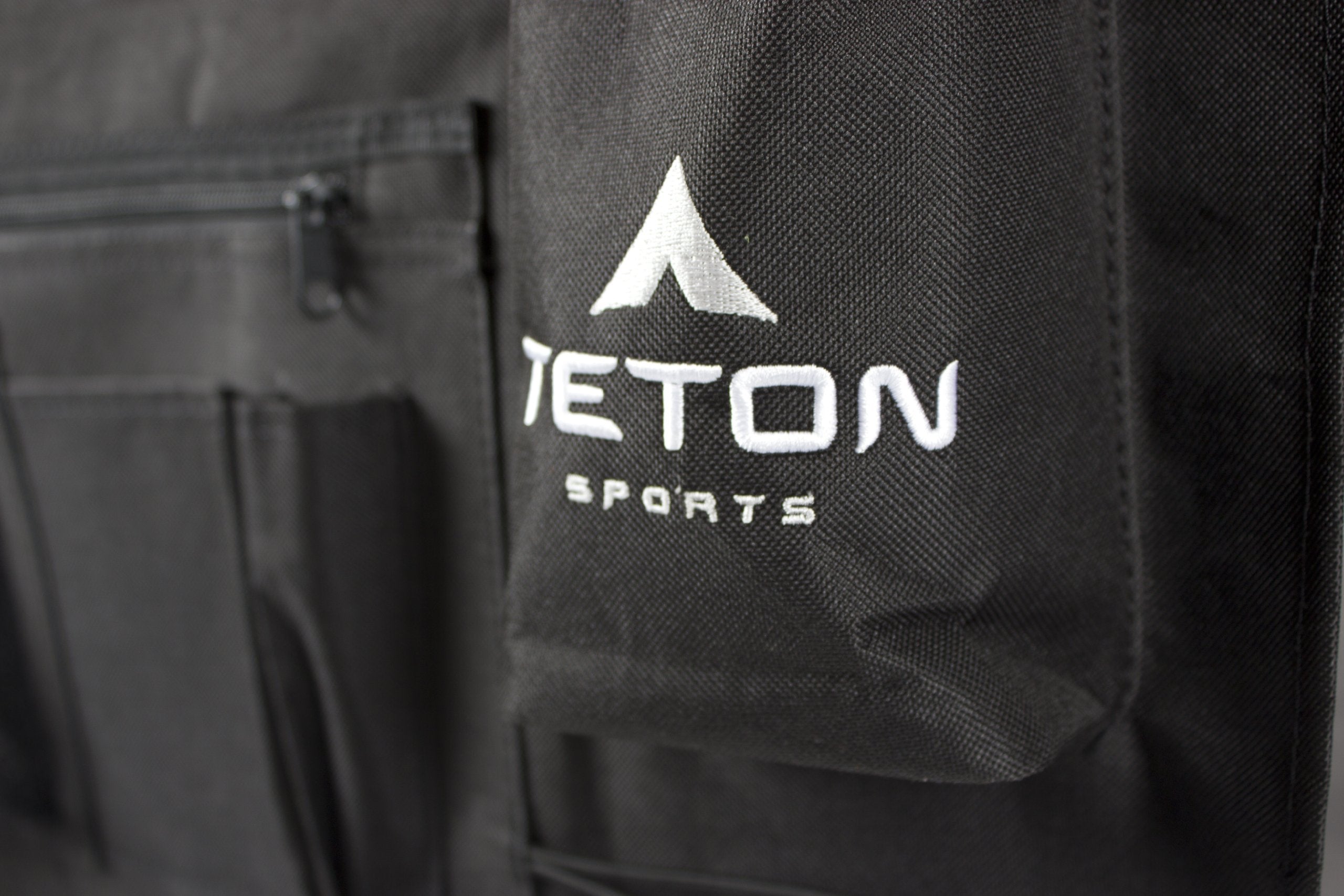 TETON cot attachment straps secure items to the cot for a tidy setup.