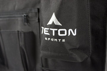 TETON cot attachment straps secure items to the cot for a tidy setup.