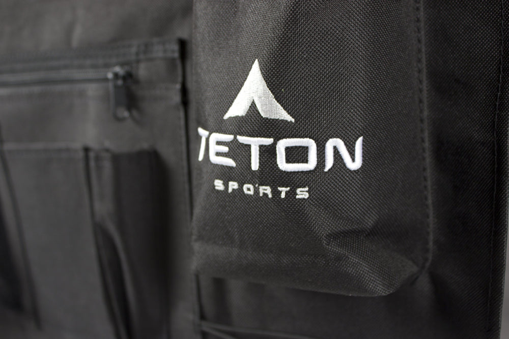TETON cot attachment straps secure items to the cot for a tidy setup.