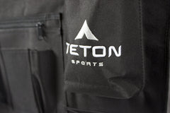 TETON cot attachment straps secure items to the cot for a tidy setup.