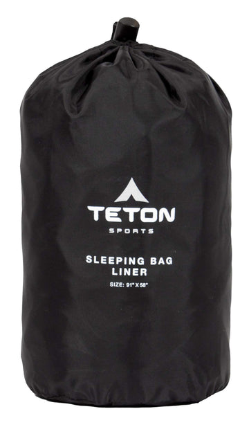 TETON Sports Mammoth Sleeping Bag Liner in use at campsite adds warmth.