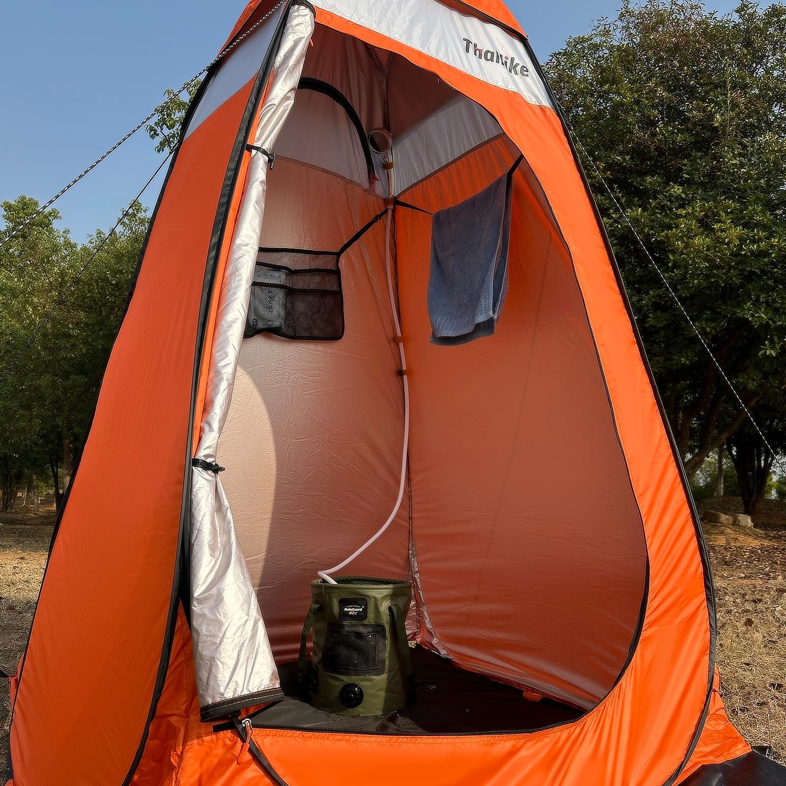 Thallike camping shower tent rain-shelter exterior enables convenient outdoor showers.