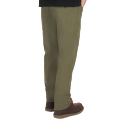 The American Outdoorsman men's 5-pocket stretch nylon pants travel-use image emphasizes quick-dry moisture-wicking comfort