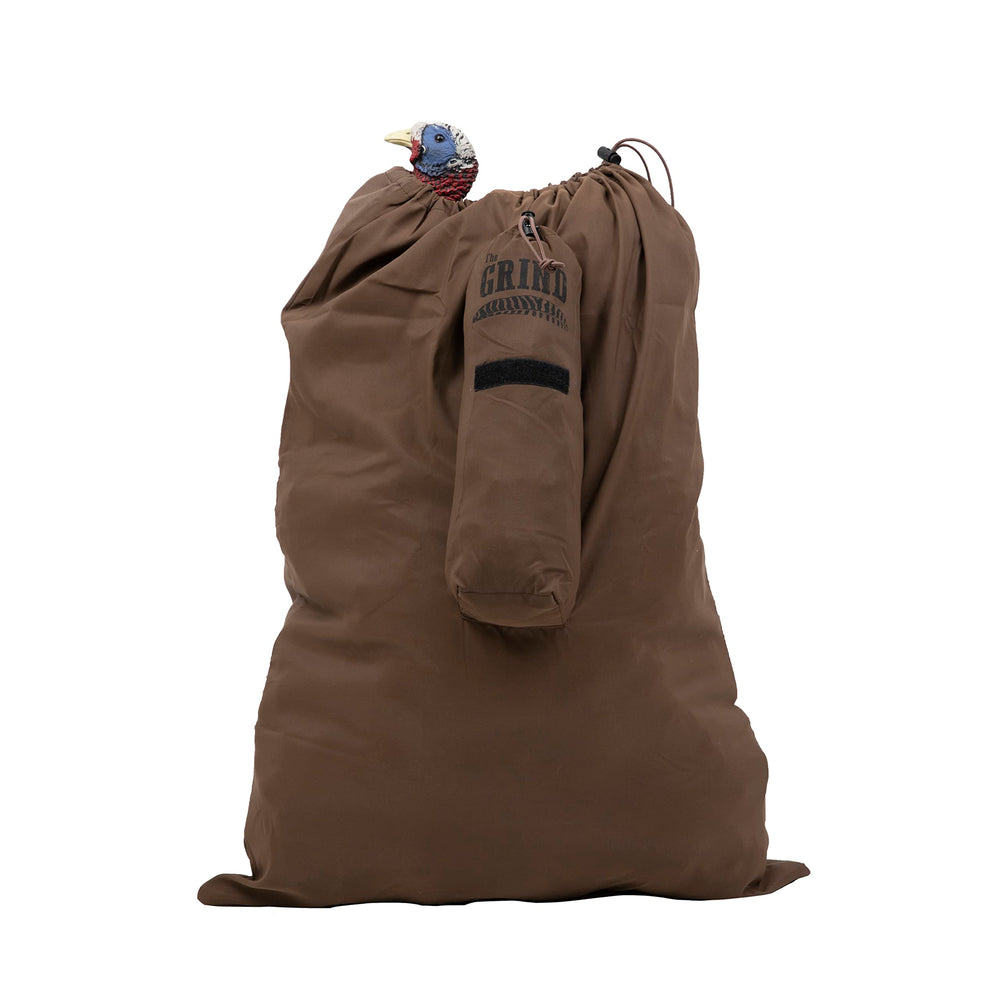 The Grind Dark Earth turkey decoy bag closed for secure transport of decoys