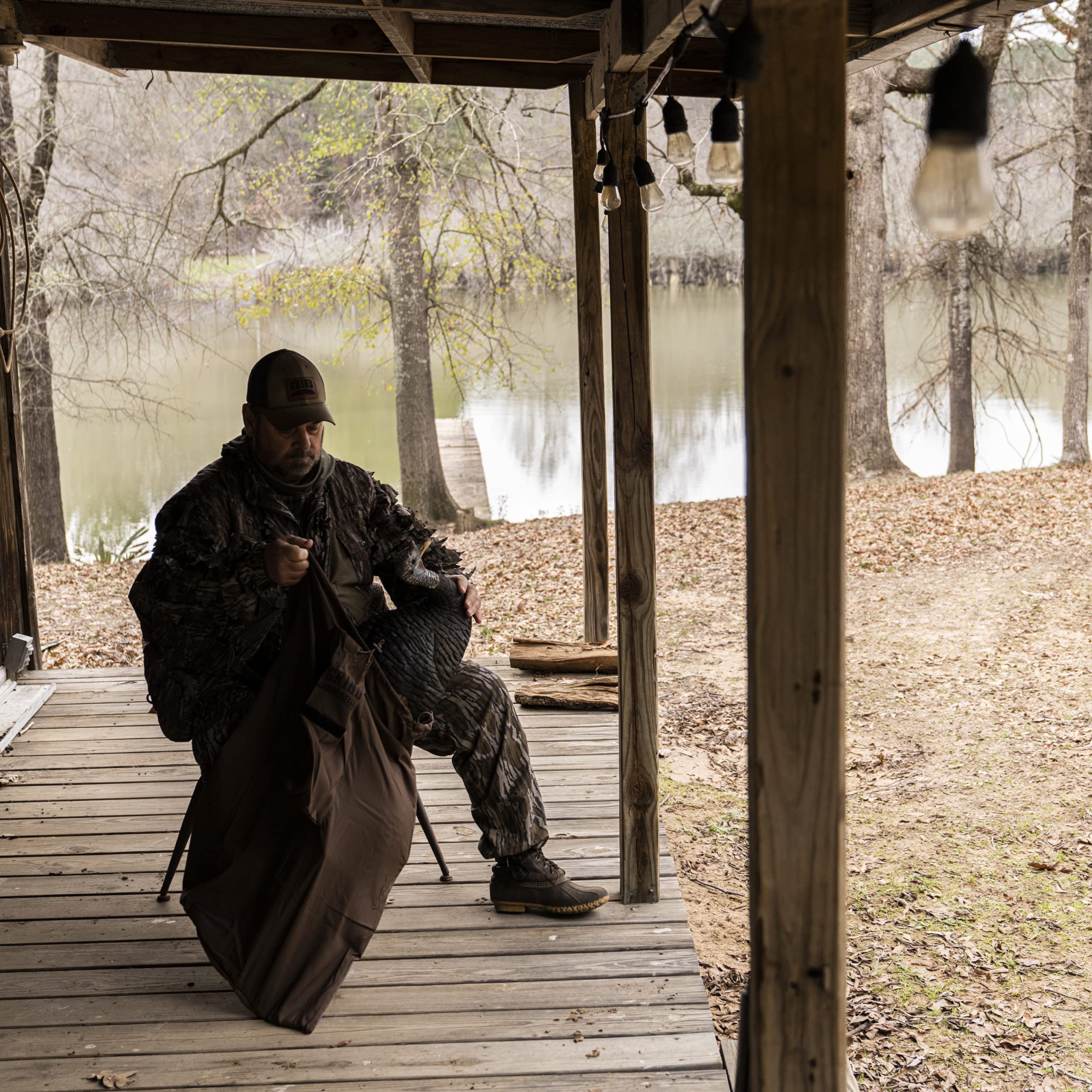 The Grind camo bag blends with terrain and protects gear, 23x33 dimensions
