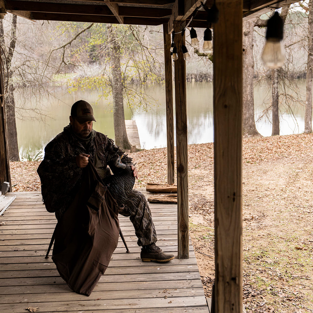 The Grind camo bag blends with terrain and protects gear, 23x33 dimensions