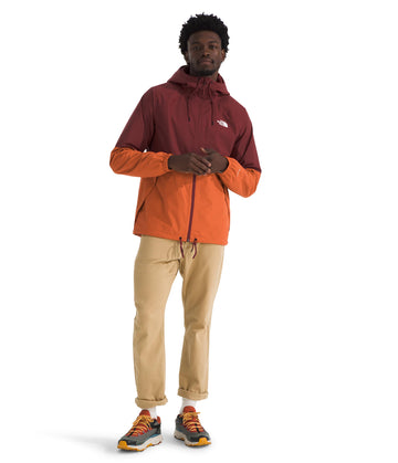 The North Face Antora Rain Hoodie back view highlights sealed seams and durability in wet weather.
