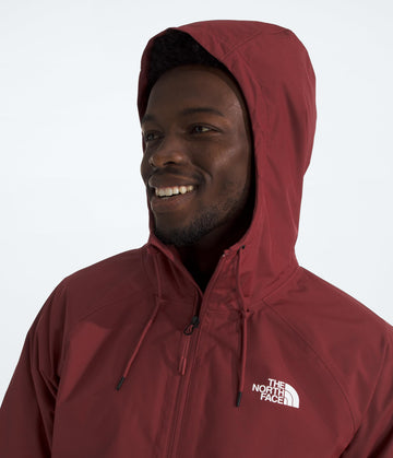 The North Face Antora Rain Hoodie pocket detail reveals secure-zip pockets for essentials.