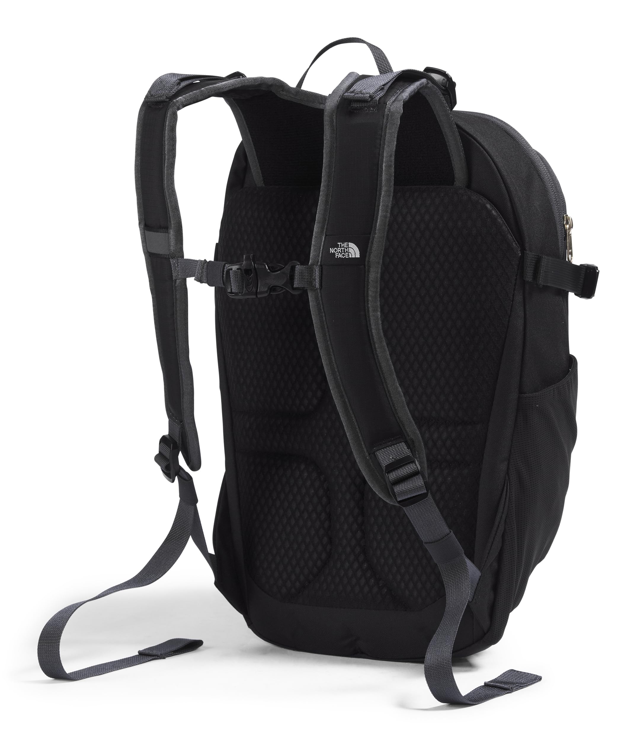 The North Face Basin 15L external-zip-pocket demonstrates fast-access storage during hikes.
