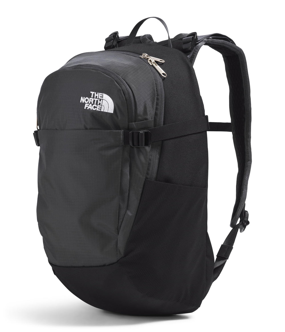 The North Face Basin 15L side-pole-attachment highlights trekking pole compatibility for quick on-trail setup.