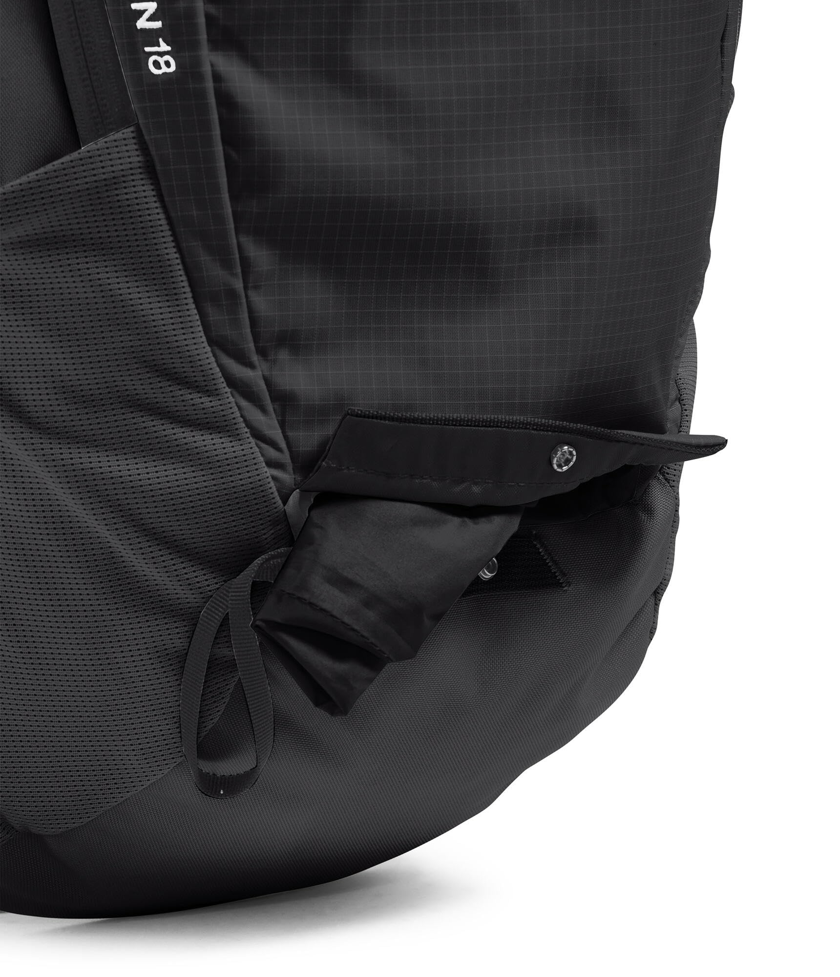 The North Face Basin 18L trekking pole attachment kept secure on the side.