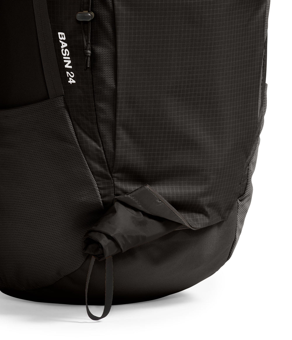 The North Face Basin 24L DWR finish on exterior signals durable, weather-ready performance.