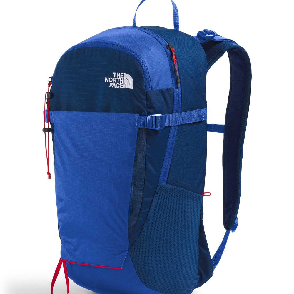 The North Face Basin 24L daypack pole attachment supports trekking staff on climbs.
