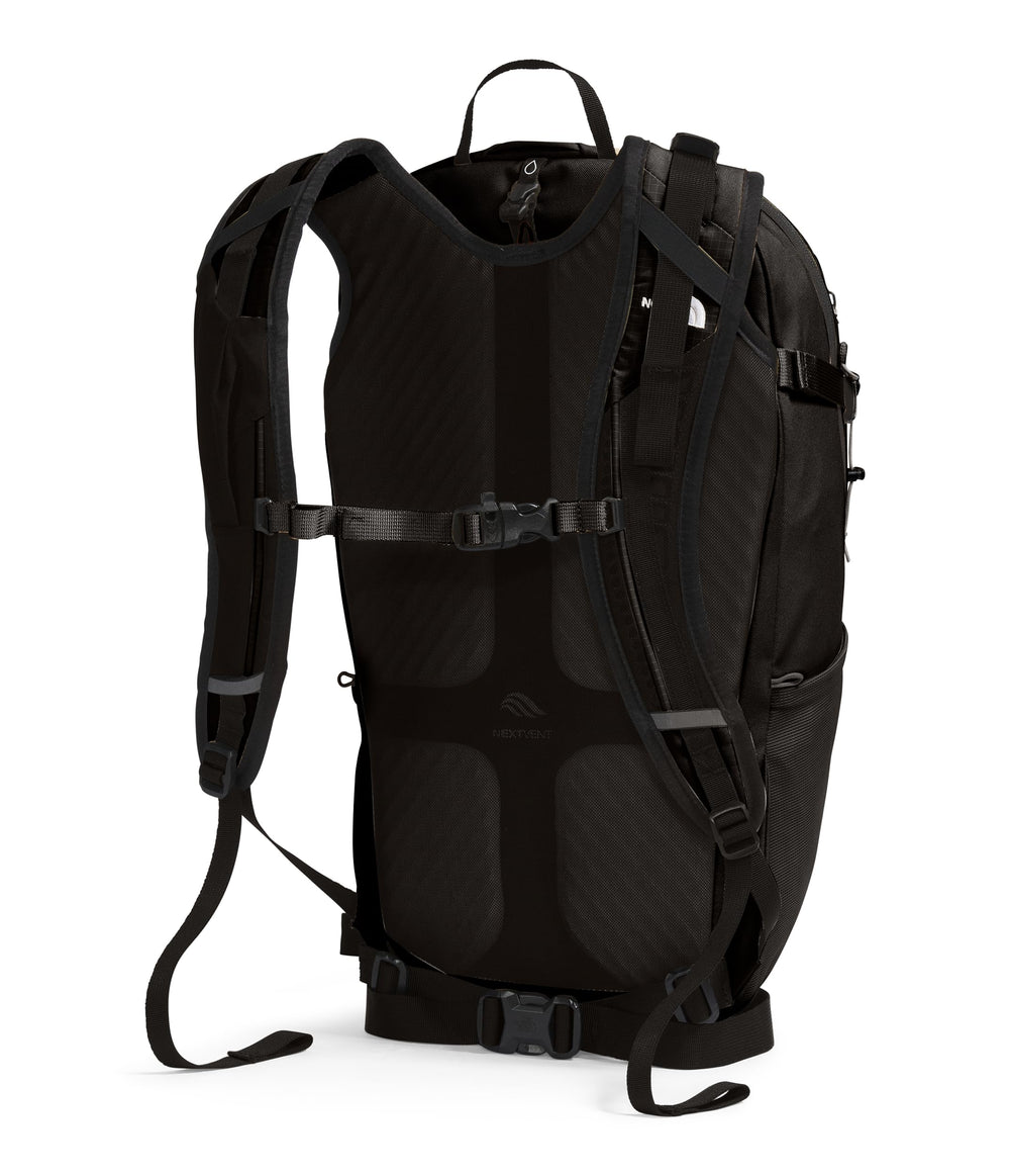 The North Face Basin 24L rain cover in use keeps gear dry during showers.