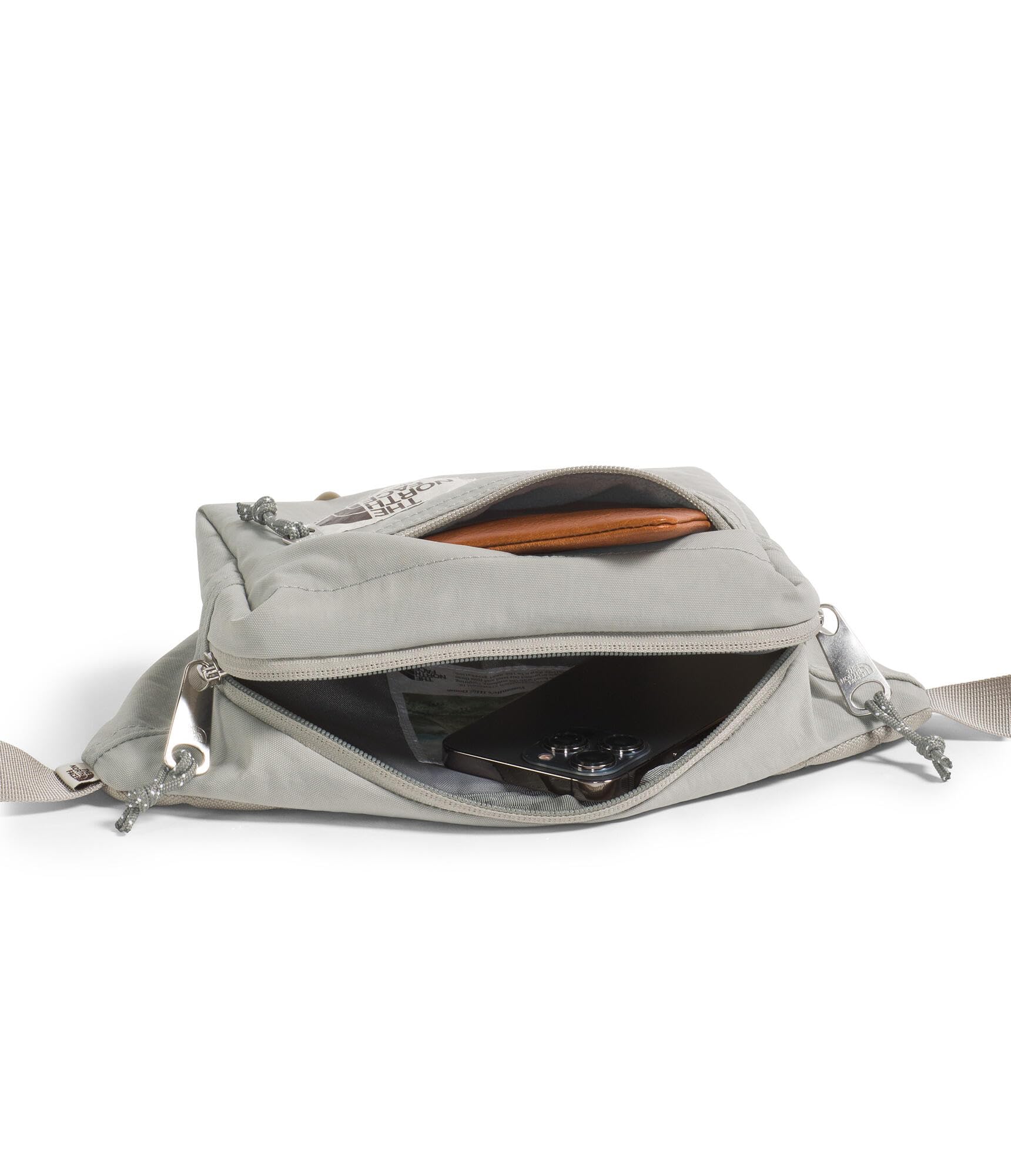 The North Face Berkeley Lumbar Bag external pocket secures sunglasses and chapstick within reach
